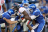LEXINGTON, KY - NOVEMBER 05:  Brandon Bolden #34 of the Mississippi Rebels is tackled by Luke McDermott #68, Avery Williamson #40 and Ridge Wilson #48 of the Kentucky Wildcats at Commonwealth Stadium on November 5, 2025 in Lexington, Kentucky.  (Photo by Andy Lyons/Getty Images)