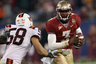 CHARLOTTE NC - DECEMBER 04:  EJ Manuel #3 of the Florida State Seminoles runs away from Jack Tyler #58 of the Virginia Tech Hokies during their game at Bank of America Stadium on December 4 2010 in Charlotte North Carolina.  (Photo by Streeter Lecka/Getty Images)