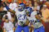 LANDOVER MD - SEPTEMBER 06: Safety #23 Jeron Johnson of and cornerback #21 Jamar Taylor of the Boise State Broncos celebrate defeating the Virginia Tech Hokies 33-30 at FedExField on September 6 2010 in Landover Maryland. (Photo by Geoff Burke/Getty Images)