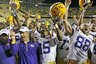 LSU coach Les Miles and LSU cornerback Brandon Taylor (15) and LSU wide receiver Ian Harding (88) celebrate after their victory over Auburn in an NCAA college football game  in Baton Rouge, La., Saturday, Oct. 24, 2009.   LSU defeated Auburn  31-10. (AP Photo/Bill Haber)