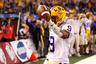 ARLINGTON TX - JANUARY 07: Jordan Jefferson #9 of the Louisiana State University Tigers celebrates after scoring a touchdown during the game against the Texas A&M Aggies during the AT&T Cotton Bowl at Cowboys Stadium on January 7 2011 in Arlington Texas. (Photo by Chris Graythen/Getty Images)